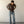 Load image into Gallery viewer, 5'7" Man wearing a brown shirt and blue jeans against a plain white wall.
