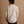 Load image into Gallery viewer, A short male model wearing a tan flannel button-up shirt and dark pants, shown from the back against a warm brown studio backdrop.

