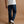 Load image into Gallery viewer, A person shown from the back wearing dark blue straight-leg jeans, a white t-shirt, and white sneakers with black stripes, standing against a solid tan studio background.

