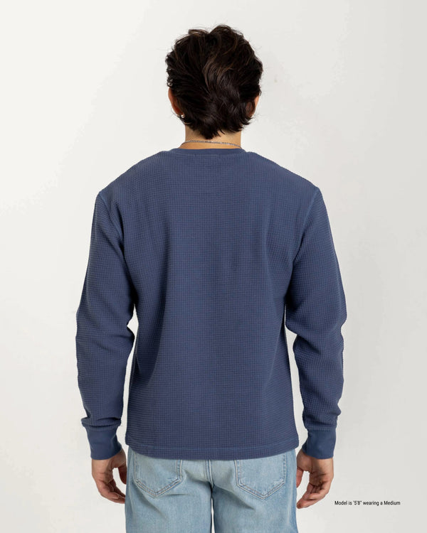 Short Male Person wearing a blue long-sleeve shirt on a white background