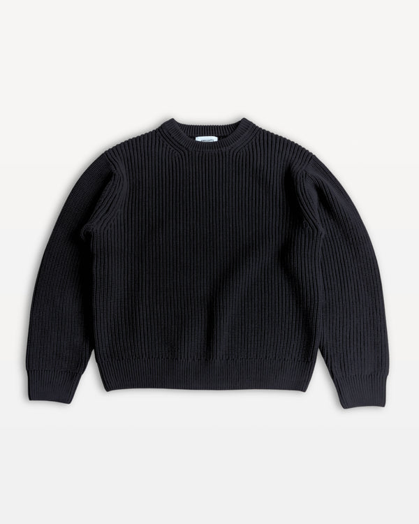 Black sweater on a light gray background