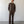 Load image into Gallery viewer, Man wearing a brown outfit standing against a white wall.
