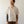 Load image into Gallery viewer, Man wearing a beige short-sleeve shirt against a plain background
