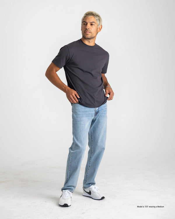 dark grey shorter men's t-shirt pose