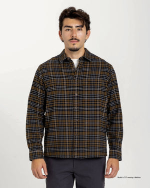 Short Man wearing a brown plaid shirt on a white background
