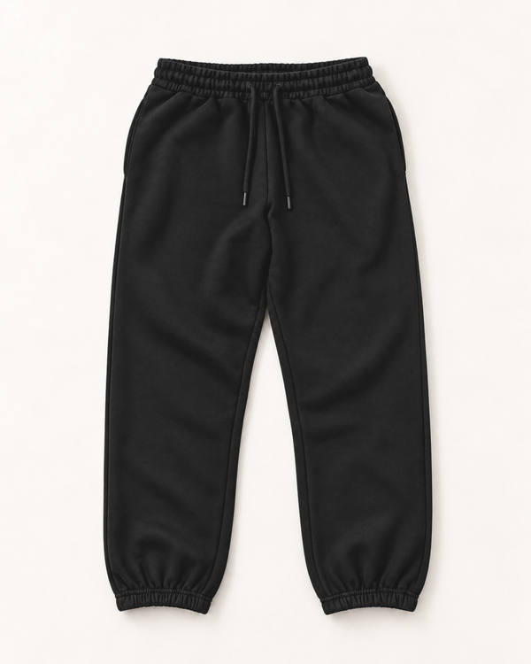 Black jogger sweatpants for shorter men laid flat, with drawstring waist, side pockets and elastic ankle cuffs