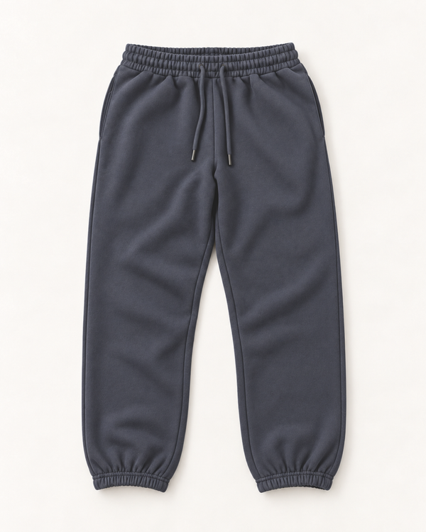 Stone medium grey jogger sweatpants for shorter men laid flat, with drawstring waist, side pockets and elastic ankle cuffs