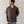 Load image into Gallery viewer, Shorter Man wearing a brown short-sleeve shirt and blue jeans against a plain background
