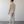 Load image into Gallery viewer, Man wearing a beige suit standing against a plain white wall.
