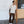 Load image into Gallery viewer, Man wearing a beige shirt and brown pants standing against a white wall.

