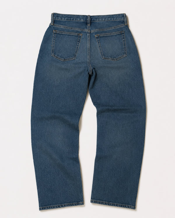 short men's blue jeans back on white background