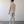 Load image into Gallery viewer, Man wearing a beige suit standing against a plain white wall.
