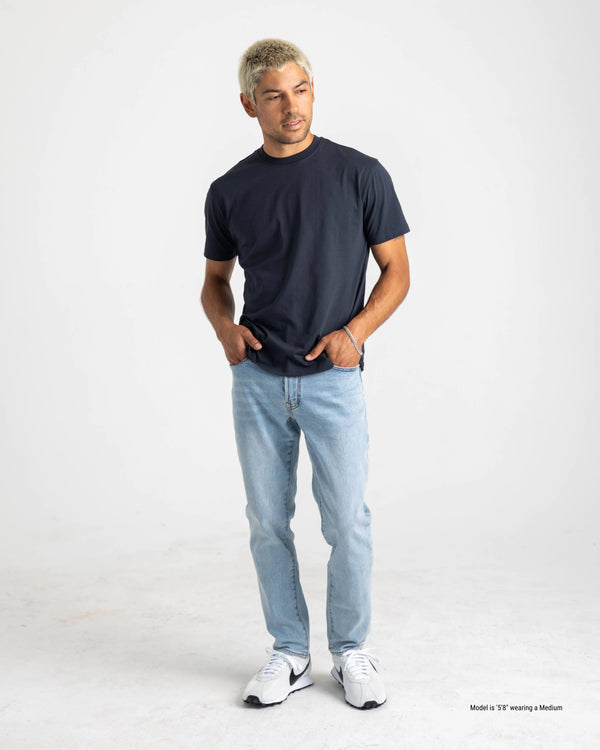 navy standard t-shirt for shorter men pose