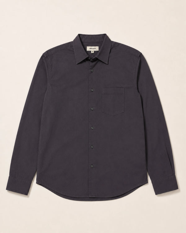 a dark button up shirt on a white background