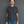 Load image into Gallery viewer, Shorter Man wearing a plain black t-shirt and blue jeans against a gray background
