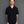 Load image into Gallery viewer, Man wearing a black short-sleeve button-up shirt against a gray background
