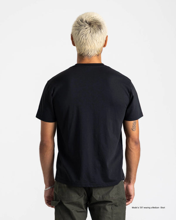 Person wearing a black t-shirt on a plain background