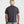 Load image into Gallery viewer, Person wearing a black t-shirt on a plain background
