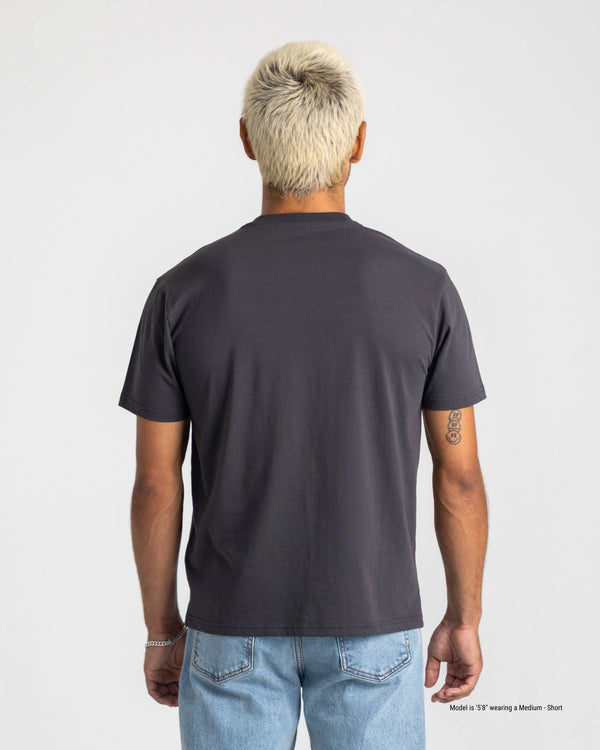 Person wearing a black t-shirt on a plain background