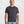 Load image into Gallery viewer, Man wearing a plain black t-shirt against a white background
