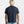 Load image into Gallery viewer, Person wearing a navy blue t-shirt on a plain background
