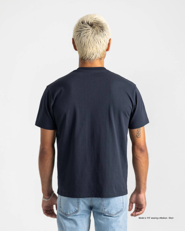 Person wearing a navy blue t-shirt on a plain background