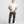 Load image into Gallery viewer, Man wearing a white t-shirt and dark pants on a plain background

