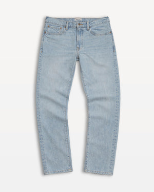 Short Man wearing a white sweater and blue jeans on a white background