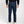 Load image into Gallery viewer, Shorter Person wearing dark blue jeans and a black shirt on a white background
