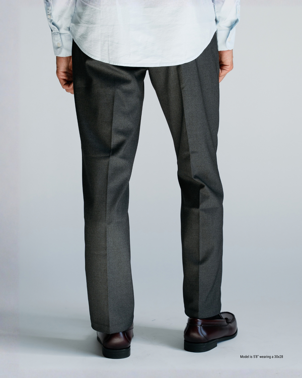 Back view of charcoal straight-leg trousers showing seat and leg fit on a shorter man
