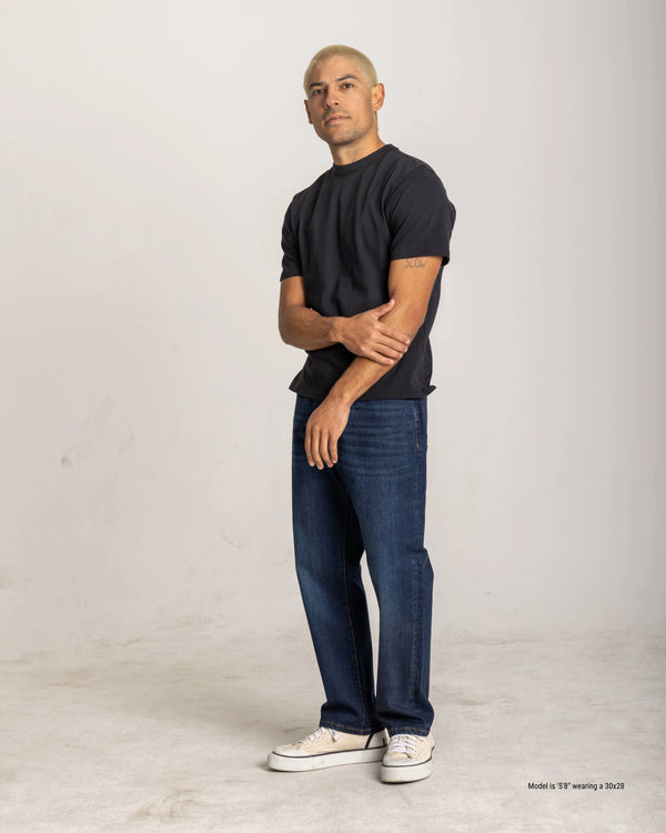 straight fit jeans for short men dark wash posed