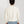 Load image into Gallery viewer, Short Person wearing a white sweater and light blue jeans on a plain background
